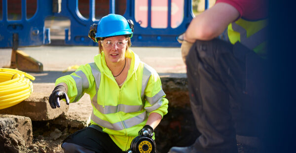 EUSR utilities female worker carrying out gas checks for underground utilities work.