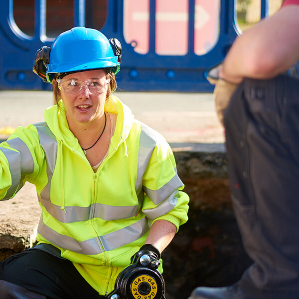 EUSR utilities female worker carrying out gas checks for underground utilities work.